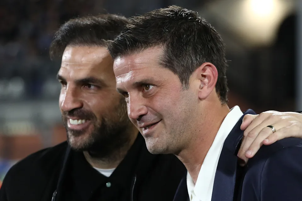 Cesc Fàbregas and Cristian Chivu before kickoff at Stadio Sinigaglia